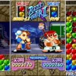 Chun-Li và Ryu trong giao diện chơi Super Puzzle Fighter II Turbo, với các khối ngọc đang rơi