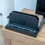 Dock Nintendo Switch 2 với bộ chuyển đổi dbrand Killswitch Dock Adapter đã lắp đặt, cho phép dock máy khi vẫn đeo ốp.