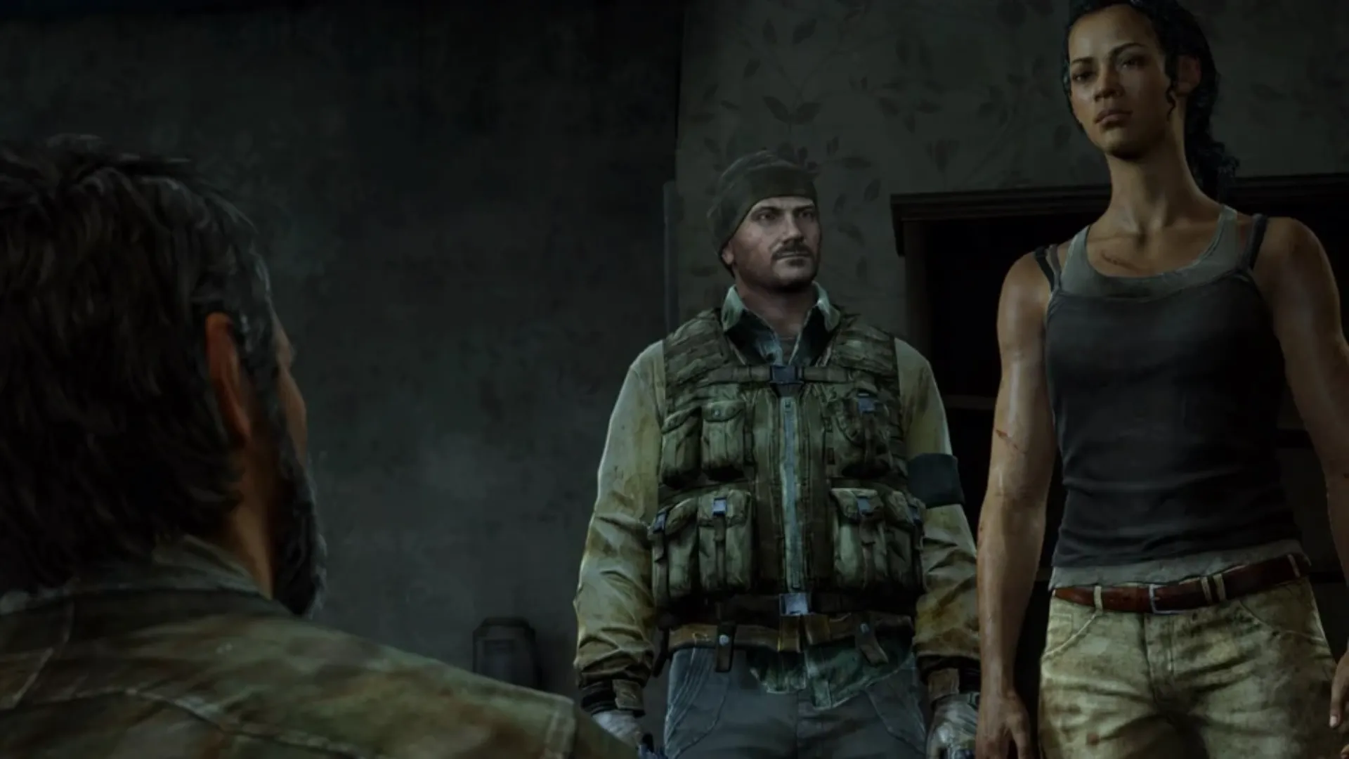 Joel trong The Last of Us đối mặt với nhóm The Fireflies, thể hiện sự căng thẳng và quyết liệt.