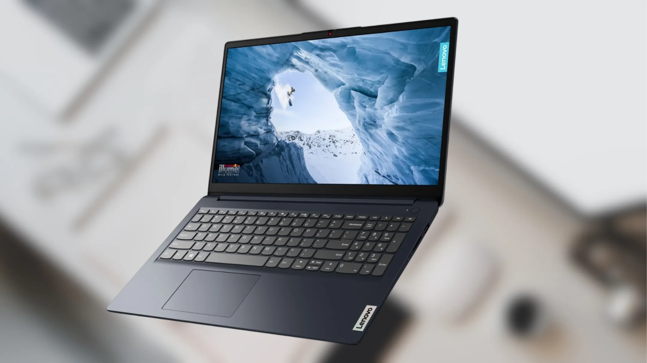 Laptop Lenovo IdeaPad 1i màu xám Storm Grey nhìn từ góc cao với màn hình mở 100 độ, đặt trên bàn làm việc