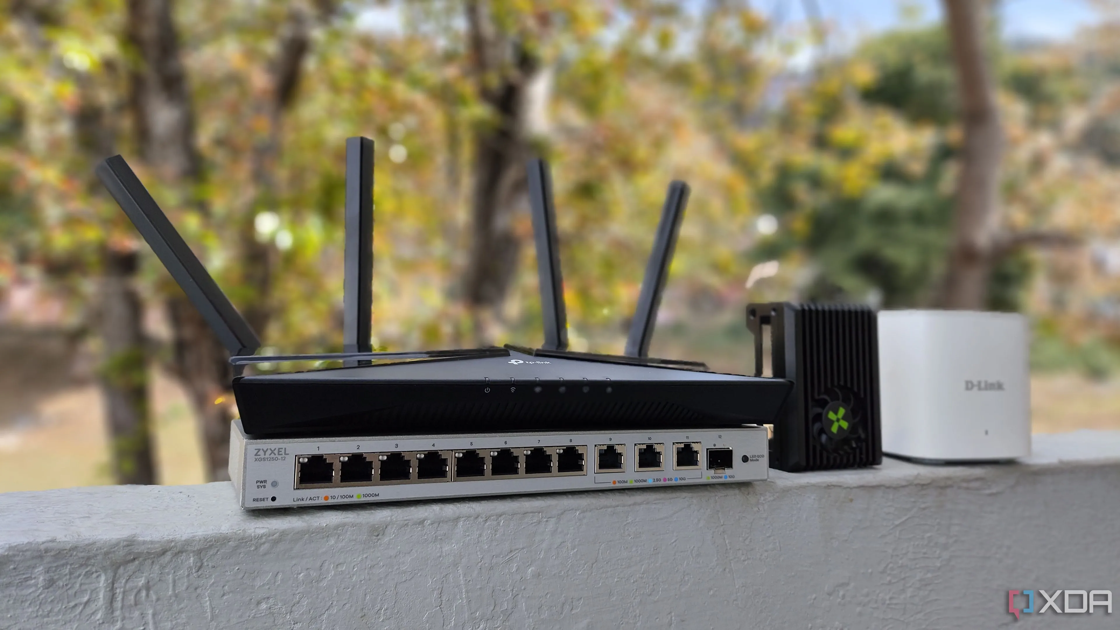 Tổng quan các thiết bị mạng bao gồm router TP-Link, SBC Radxa X4 và switch mạng Zyxel minh họa việc nâng cấp hệ thống